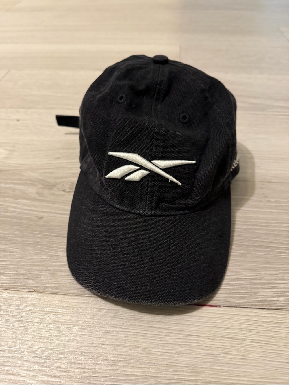 Reebok Black Cap with White Vector Logo